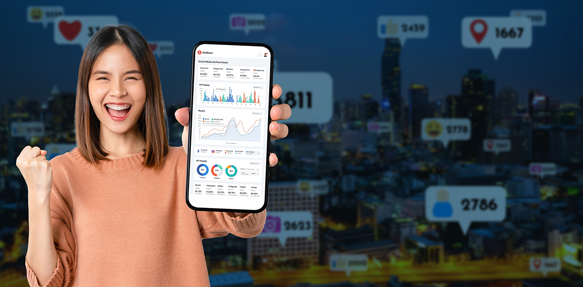 Marketer celebrating Social Selling success with analytics on mobile