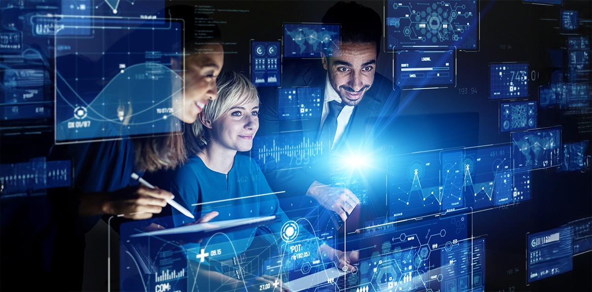 Business team analyzing futuristic digital dashboards, representing collaboration in Partnering.