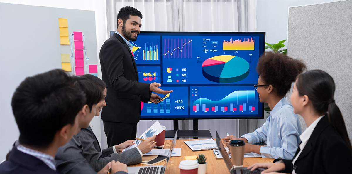 MSP business team analyzing data charts and performance metrics for growth strategy.