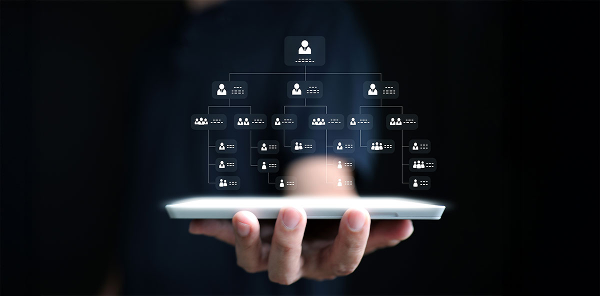 Digital organizational chart hovering above a tablet, symbolizing Partner Ecosystem management and structured collaboration.