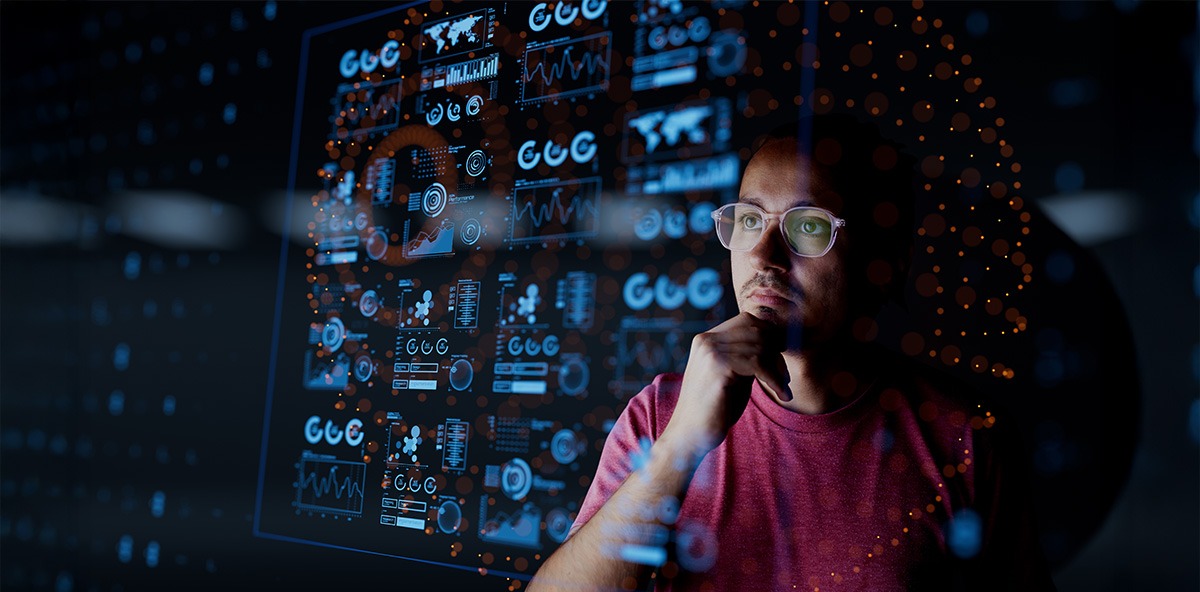 Person analyzing digital dashboards and data visualizations related to PartnerOps performance.